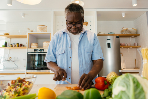 Senior monitoring blood glucose with meter, proactive step to safeguard against diabetic eye disease