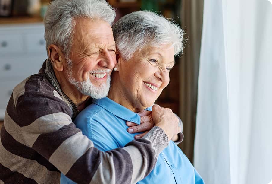 Outdoors smiling senior in checkered shirt – renewed wonder via cataract care.