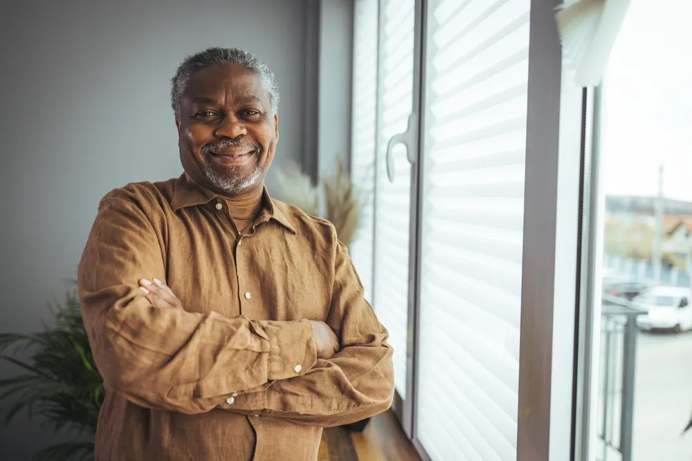 Senior man applying eye drops post-surgery – essential care for recovery